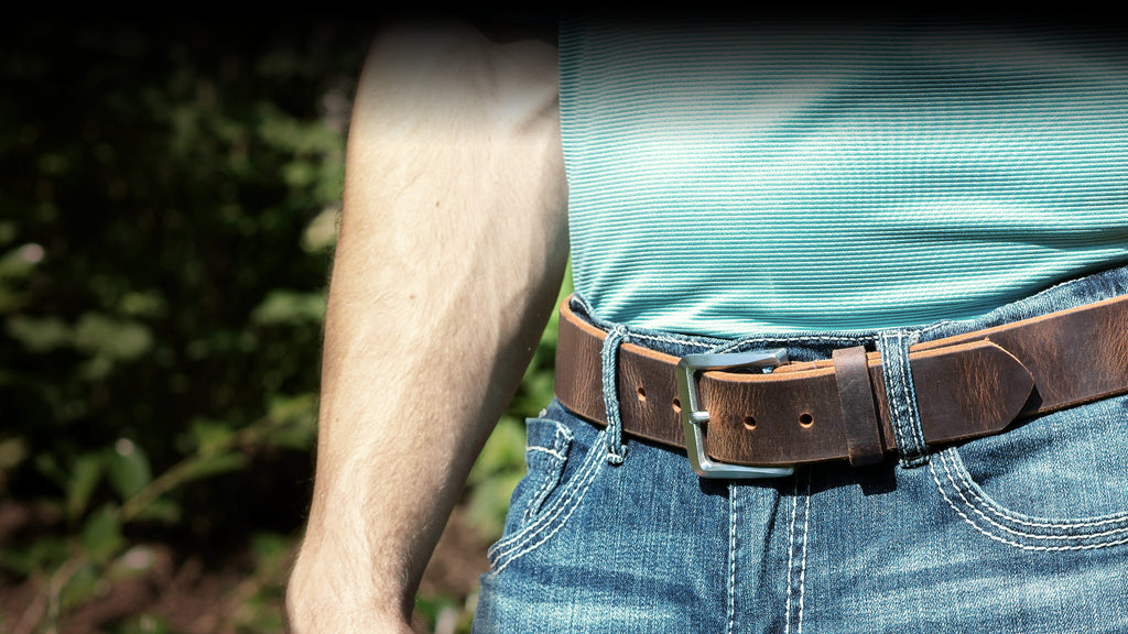 Pure titanium belt buckle sewn onto distressed leather belt.  Nickel Free. Made in USA